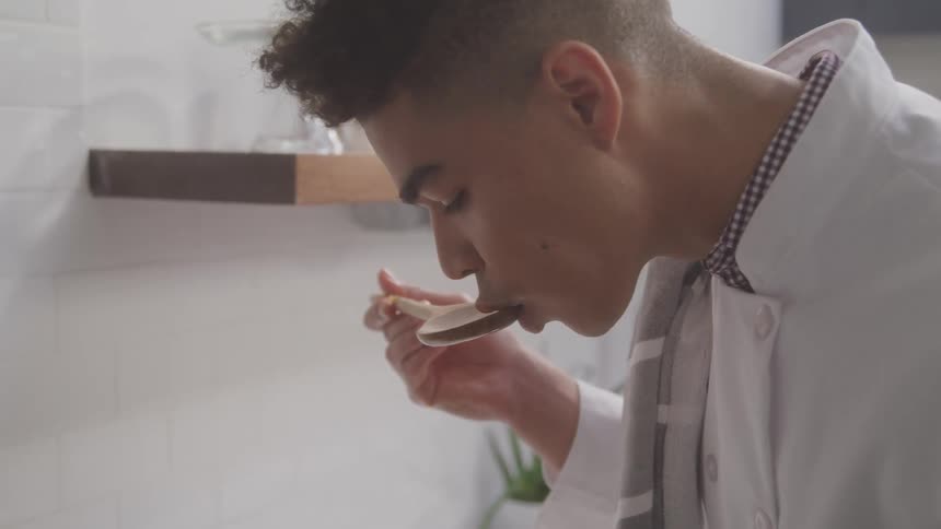 A footage of a boy tasting a recipe