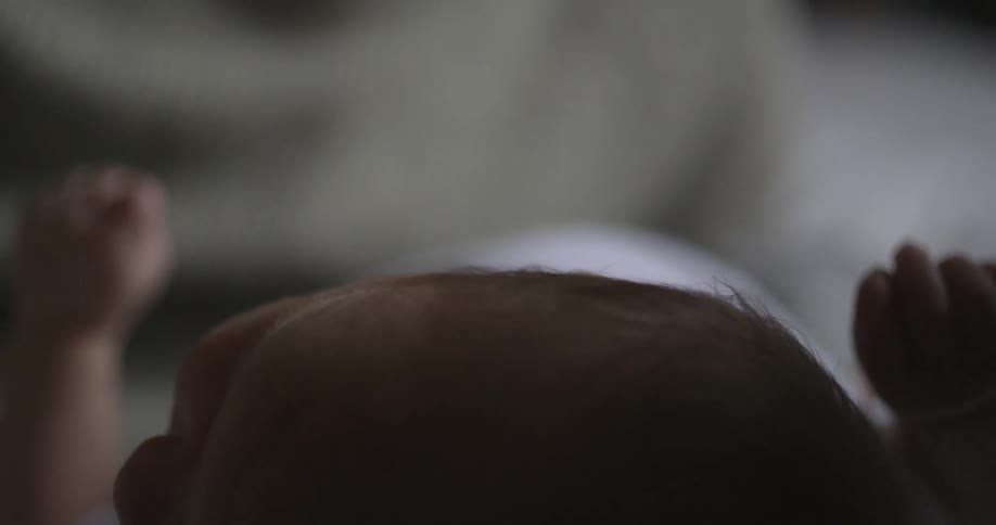 A man talks to and cares for an infant