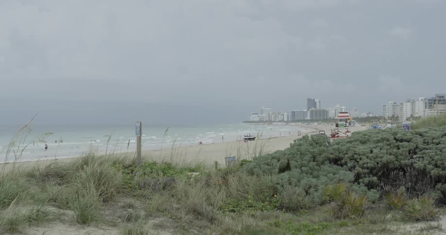 Thick clouds covering a city beach