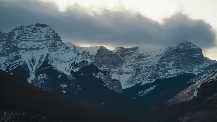 Timelapse of snowcapped Mount Bogart at sunset in Kananaskis, Canada