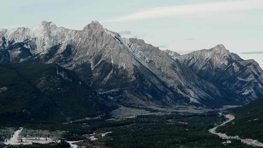 Tall mountain peaks are covered in ice and snow