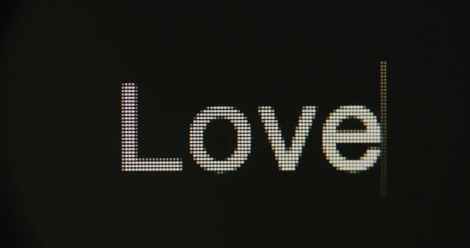 The word love flashes onto a black screen
