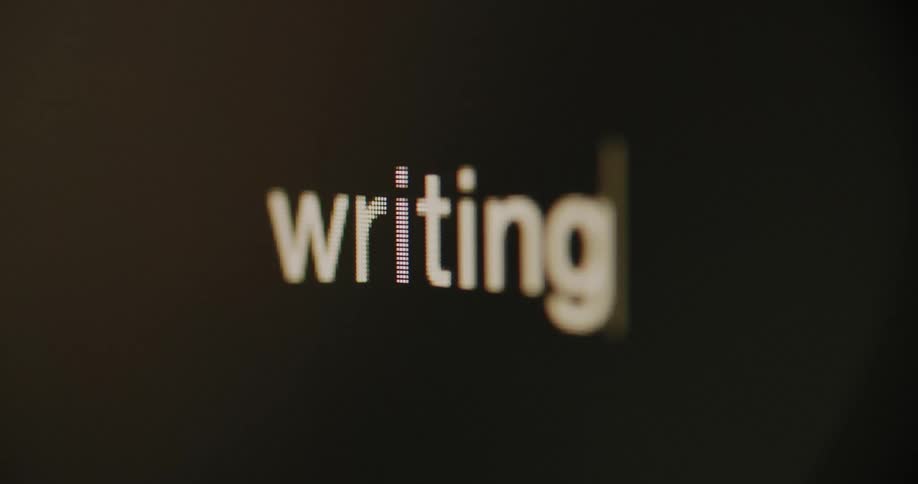 Cursor blinks on the screen at the end of the word writing