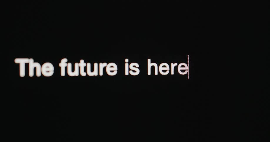 White letters text being displayed on a black background digital screen