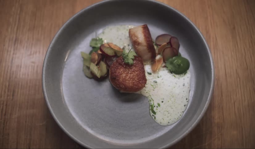A person takes the dish of food