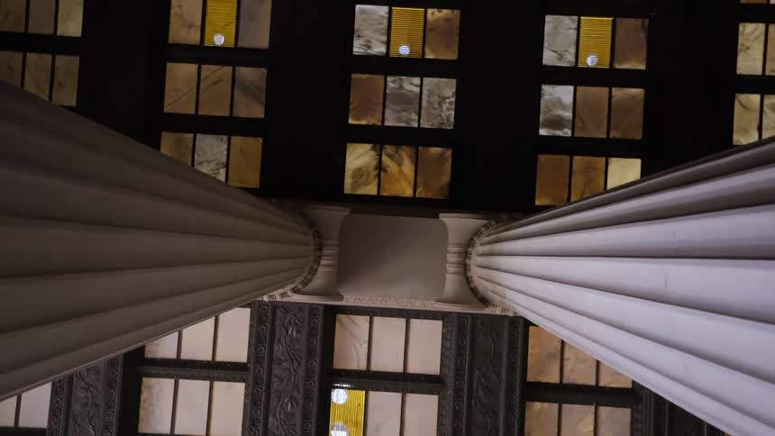 Bottomup view of a ceiling with imposing pillars
