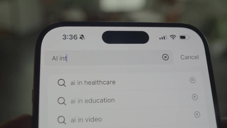 Person searches for a topic related to ai on a smartphone