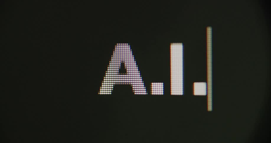 Close up of the letters ai being typed in a pixelated white font followed by a blinking cursor on a black screen
