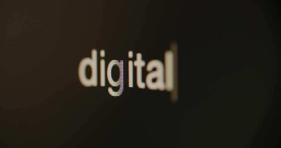 The word "digital" is typed out on the screen