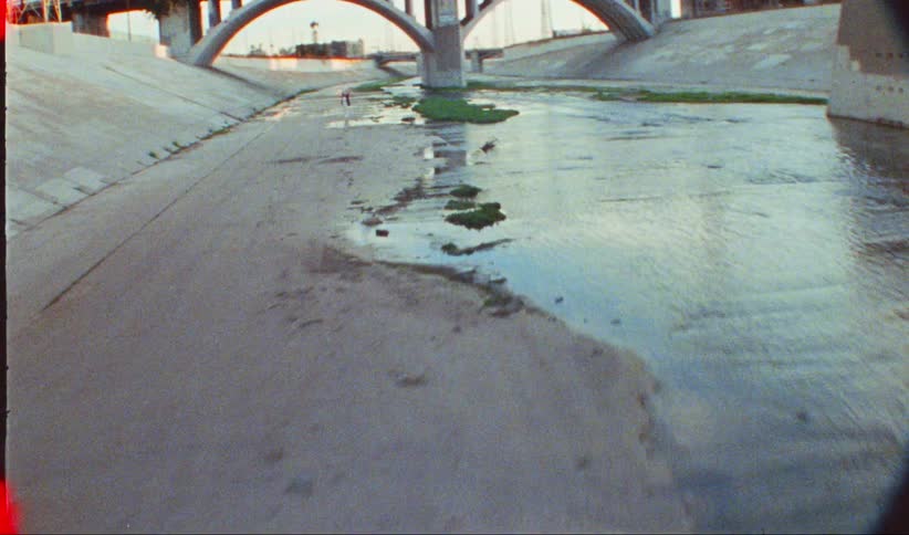 A canal in a city has only a small amount of water in it