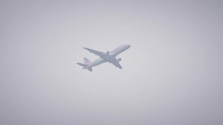 A plane flies into the heavy fog and vanishes
