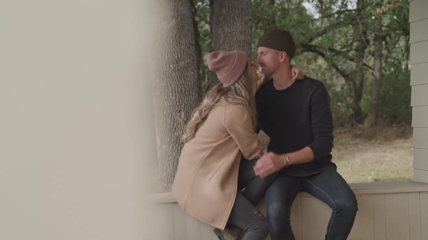 Couple sitting and kissing romantically