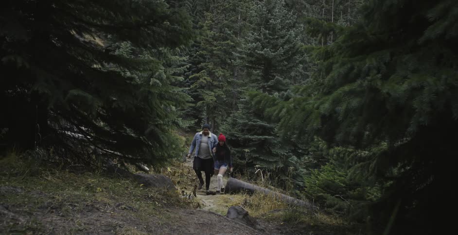 Man and woman hiking in forest