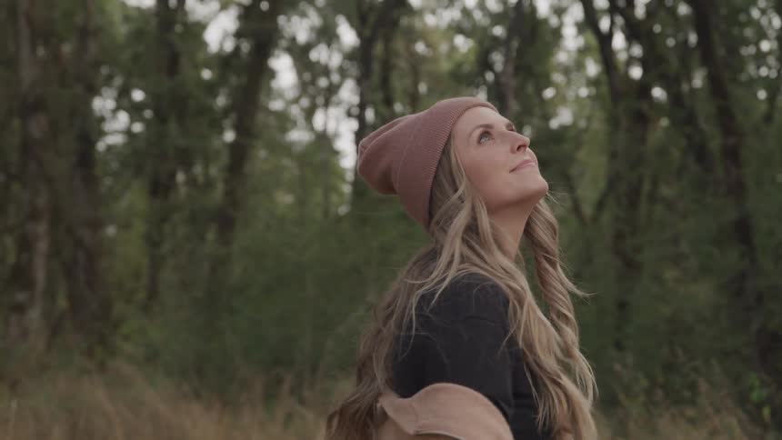 A woman walks outdoors