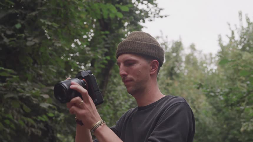 A man looks through his camera