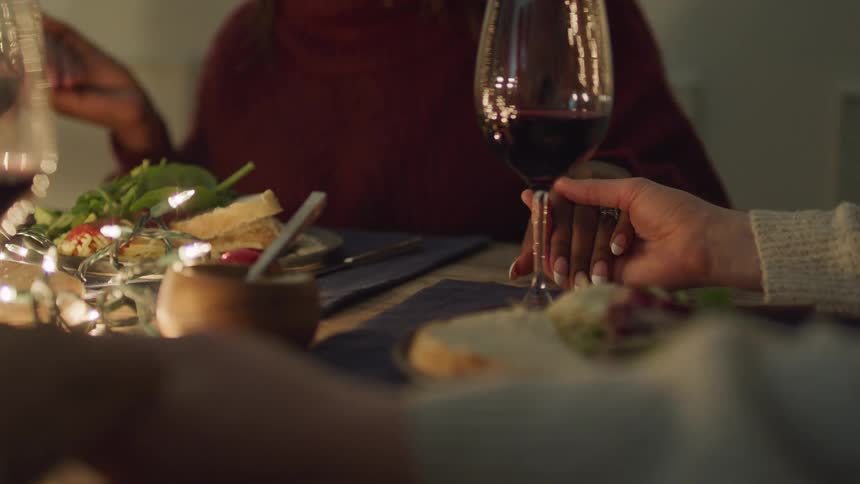 Before starting dinner people hold hands and begin to pray