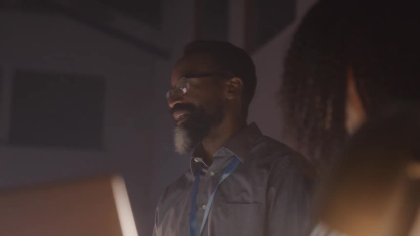 People are listening to a man in the office