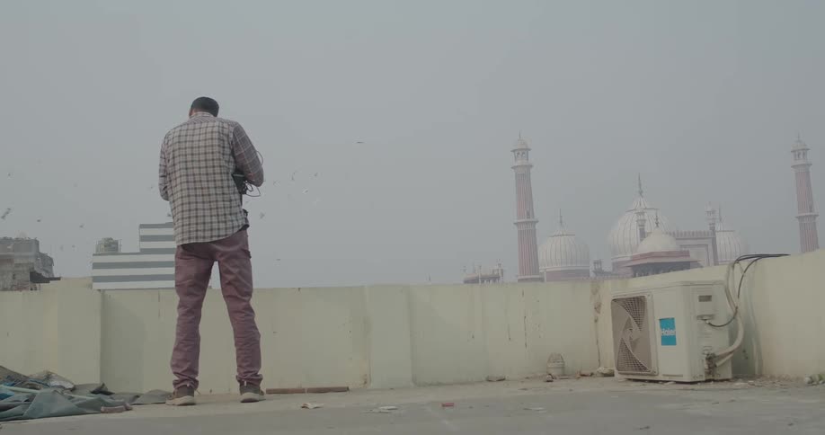 View of a man from behind on a terrace