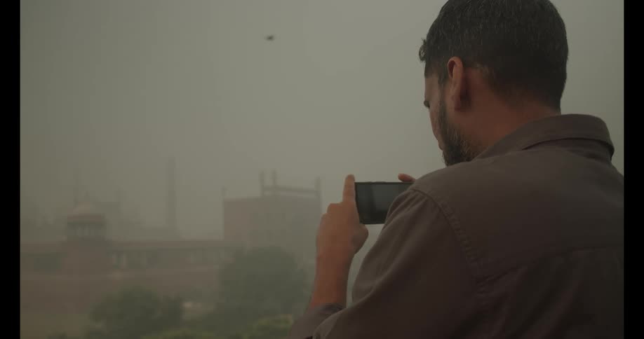A man records with his phone