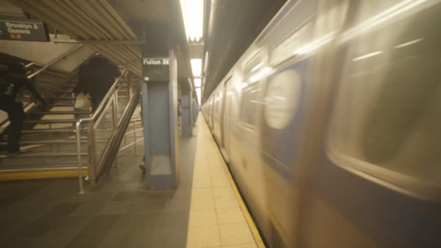 A subway speeds by the platform