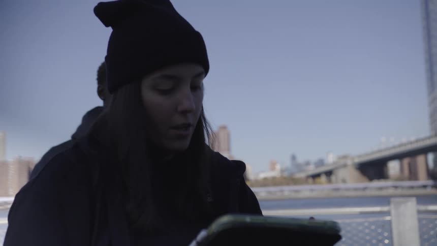 A footage of a person reading from a tablet device