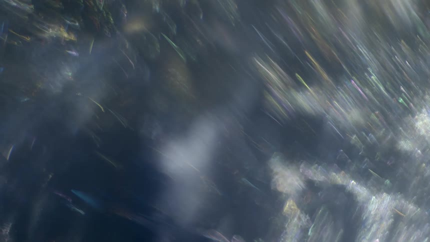 Shapes and smoke swirl around each other