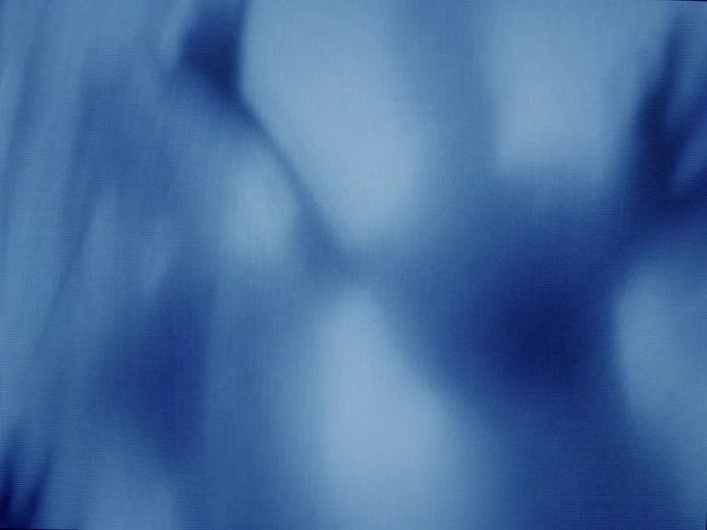 Shadow of a person behind an abstract curtain