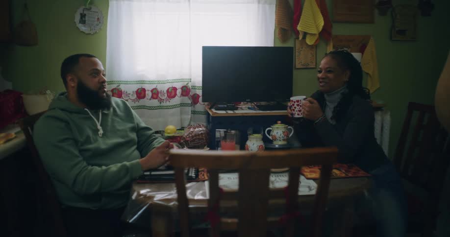 A clip of three people having a conversation indoor