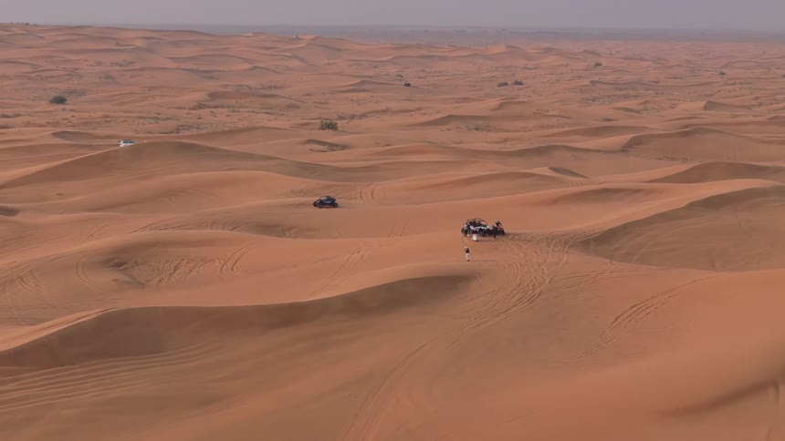 A car drives through the desert