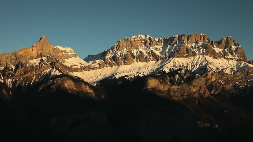 Mountain range partially covered in snow