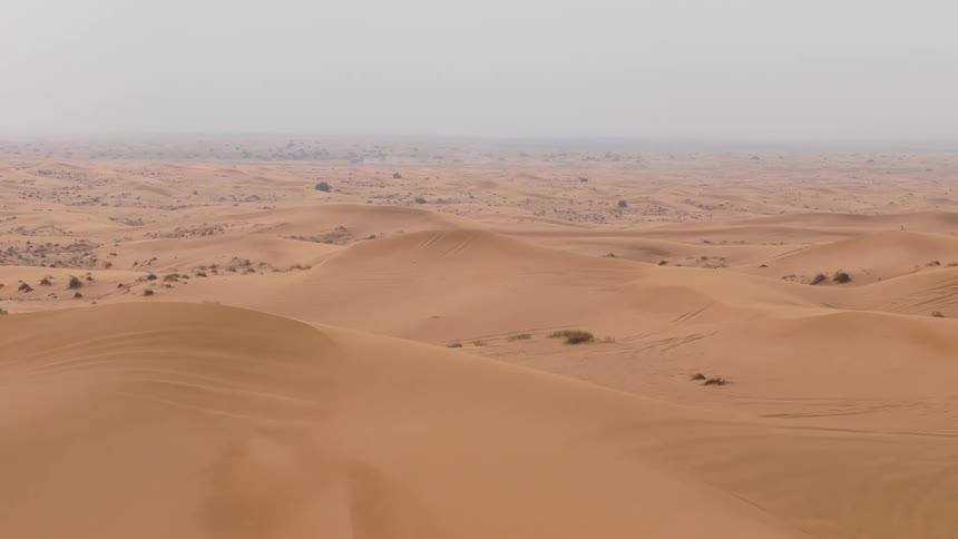 Sand dunes in a hazy desert