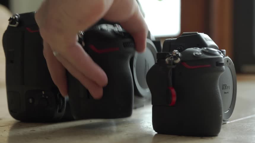 A person picks up a camera