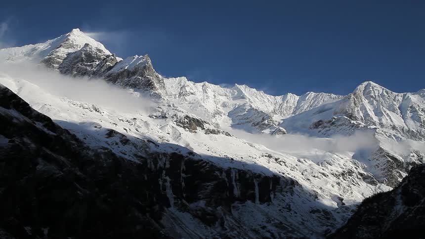 Snow-covered mountains on a clear day