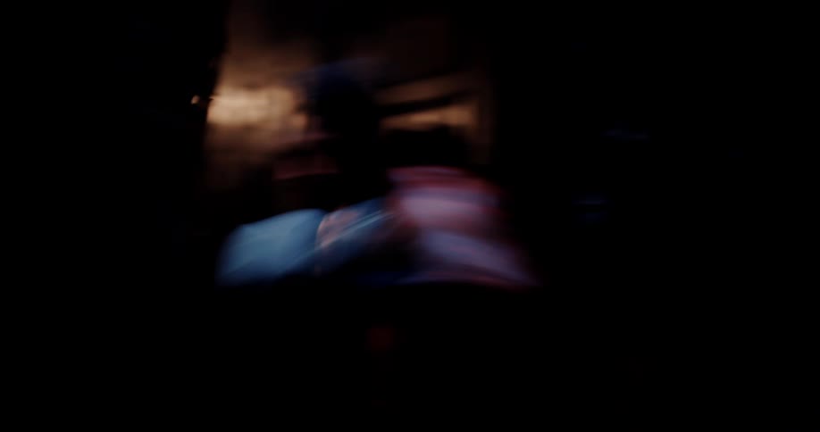 A boxer is hittingthe heavy bag