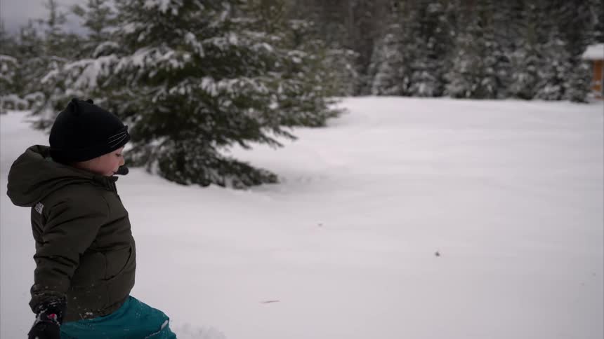 Little girl having fun walking in the snow