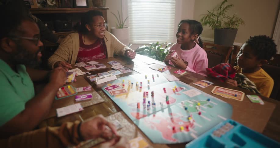 A family are playing a board game