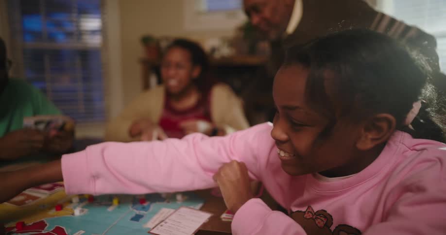 A girl makes a move on the board game