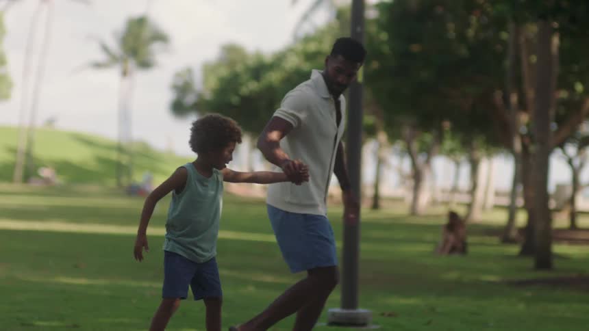 An image of a man running with his child