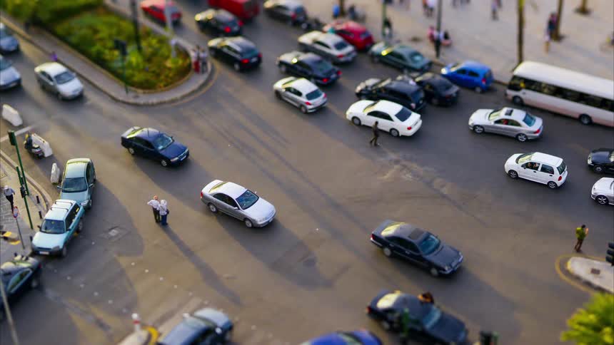 Heavy traffic is driving through the intersection