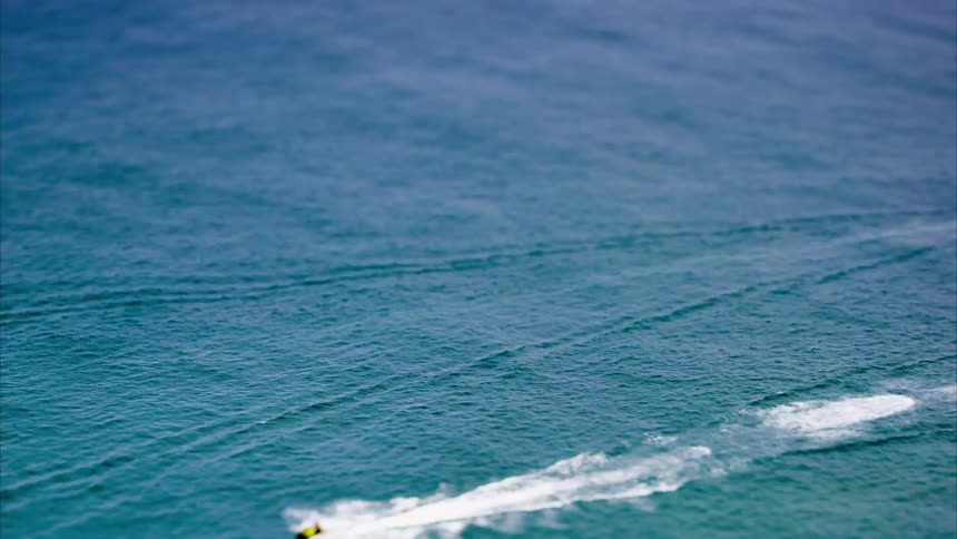 Two boats cross the water