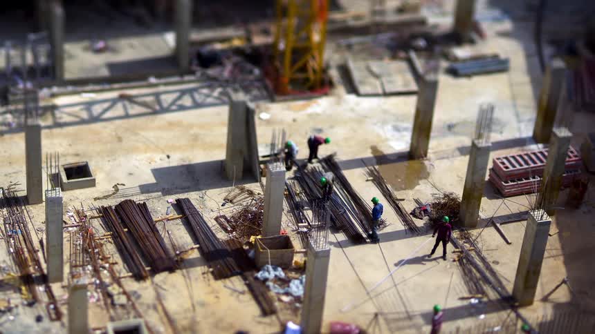 Workers are moving the rebar on the construction site