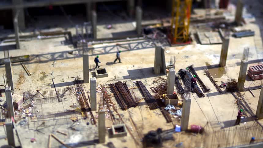 Workers are moving around on the construction site