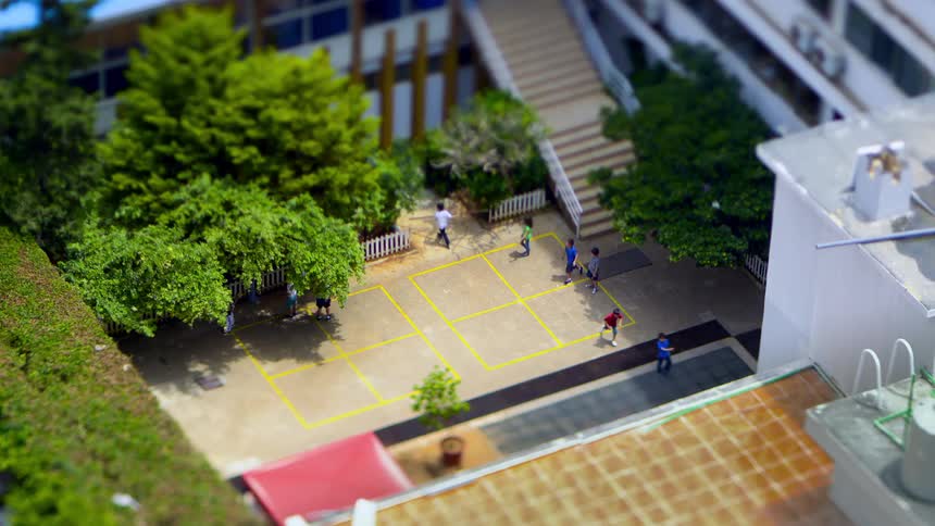 An aerial footage of children playing in the school premises