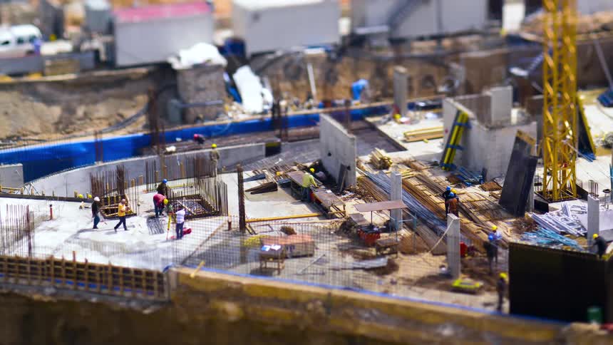 A video clip of workers working at a construction site