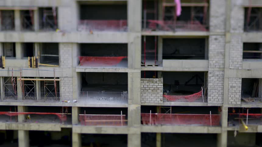 Person working in a building under construction