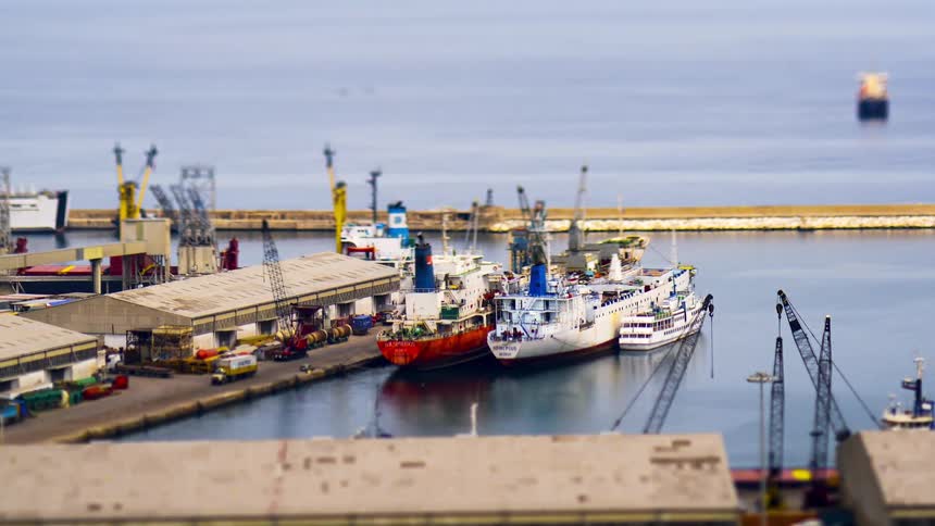 Trucks drive around the port warehouse