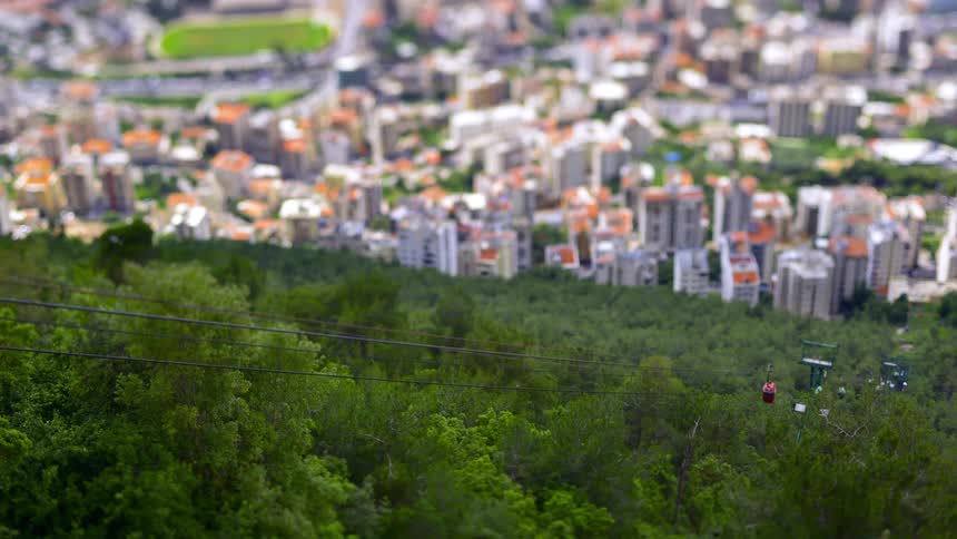 The aerial tramway runs above the city