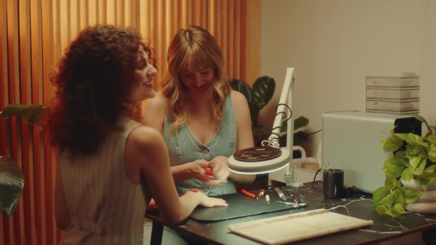 A footage of a lady fixing nails