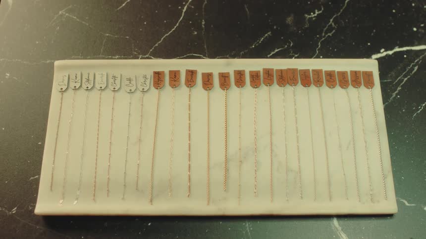 A row of bracelets have tags