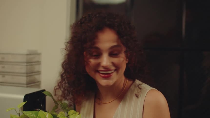 A woman is talking and smiling with friends